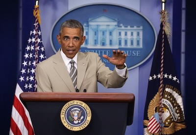 News photo from 2014, depicting Obama as accused of sartorial criming with a tan suit