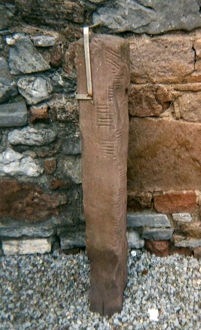 Wikipedia: a stone with an Ogham inscription, from a church in Co. Kerry.