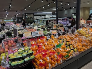 A mid-range Japanese grocery store; note the variety, order, and cleanliness.  No idea why some signs are in English.